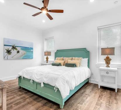 Latitude-13 1st Floor. Bedroom 1. Picture 1. King suite with private full bath with frameless glass walk-in shower. This first floor bedroom enables those with mobility challenges to easily participate in the making of the family's new memories.