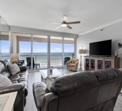 Living Room with Private Balcony Access and 60 Inch Smart TV