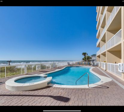 Beachfront pool and hot tub with panoramic Gulf views and sunny deck space