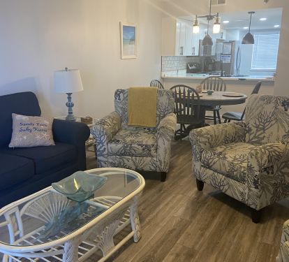 The living area offers a queen sofa bed and ample seating space.