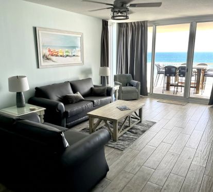 Living room with connected balcony looking over grand skyline