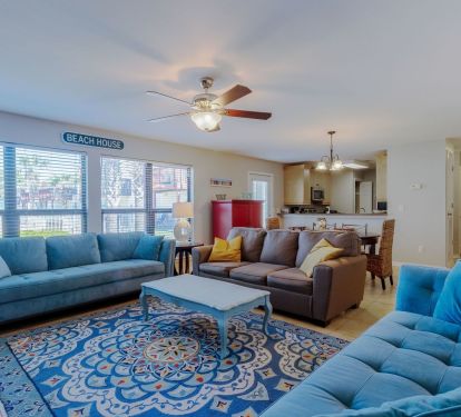 Open floor concept with a view of the back patio and  pool