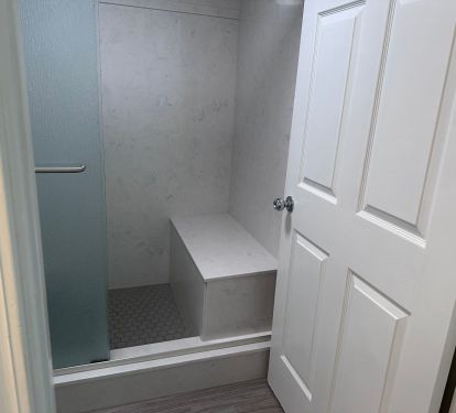 Master bath shower with bench.
