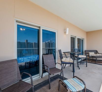 Balcony with furniture to relax and watch the water.