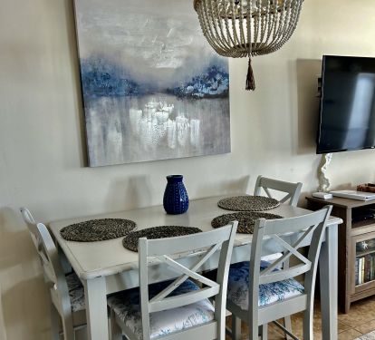 Dining table with seating for 4 plus 3 at the bar