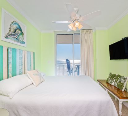 The second suite has a queen bed, private bathroom and direct balcony access
