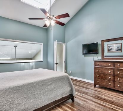 Upstairs king suite has vaulted ceiling as well