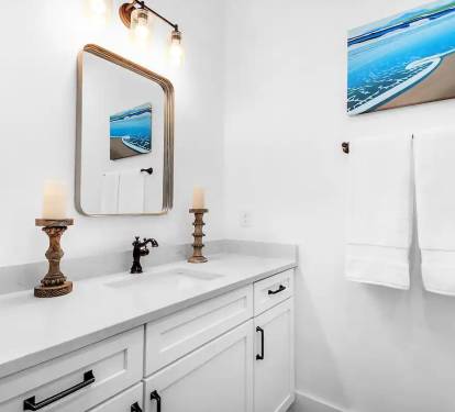 Latitude-20 1st floor. Bed 2 bath, photo 1. Quartz vanity with tiled, frameless glass walk in shower.
