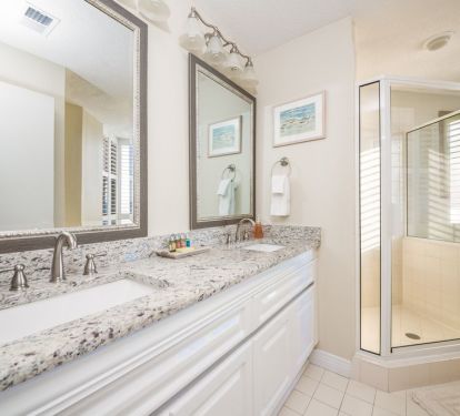 New granite countertops throughout the condo bathrooms