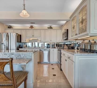 Kitchen with High-End Cabinets with Slow-Close Drawers and some Leaded Glass Doors