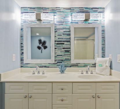A new accent wall and water-look lighting creates a classy touch