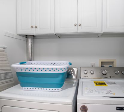 Full size washer and dryer just off the game room.