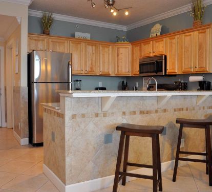 Fully accessorized upgraded kitchen with new tile.