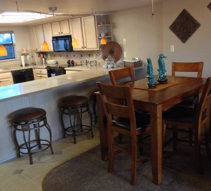 Dining table can comfortably seat 6-8, just add the leaf &amp; bar stools