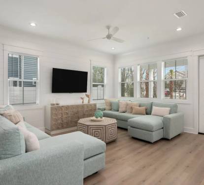 Iris-8 first-floor living room offers a blend of style and comfort in its seating arrangements.
