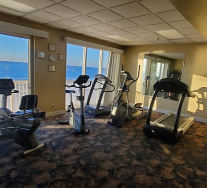 Great exercise room with a variety of machines and beautiful gulf facing view.