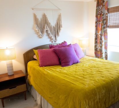 Queen bedroom with ocean views! Walkway to the beach is right outside.