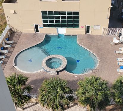 Relax and soak up some rays in our large zero entry outdoor pool..new loungers with tables for your conveneince.