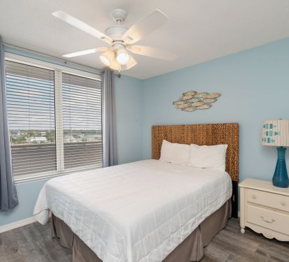 Queen-sized bed in second suite