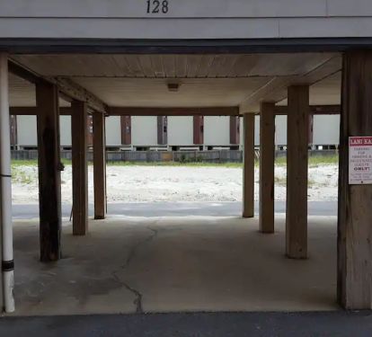Parking for one car directly under unit.  More parking across the street by pool