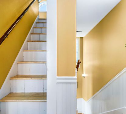 Stairs to loft going up and stairs going down leading to bedrooms
