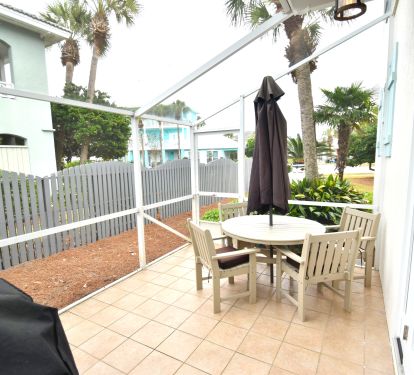 Enjoy some of your favorite grilled foods on the shaded, screened in back porch