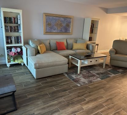 Living Room with lots and lots of books to read &amp; beach towels to use