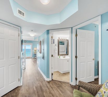 View of the Entrance Hall with doors to the second bedroom and bathroom.