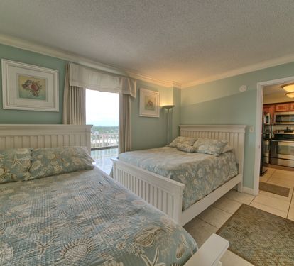 Second Bedroom with 2 double beds and TV.