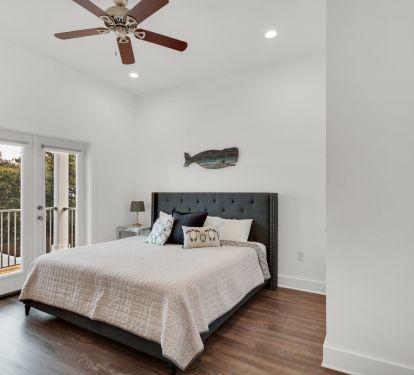 King Bedroom with private bathroom and access to deck overlooking the pool