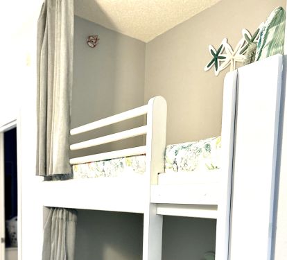 Bunk bed also has privacy curtains.
