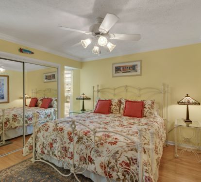 2nd bedroom with a king bed and an adjacent private bathroom