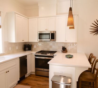 Fully stocked kitchen - fridge, icemaker, gas range, dishwasher and microwave.