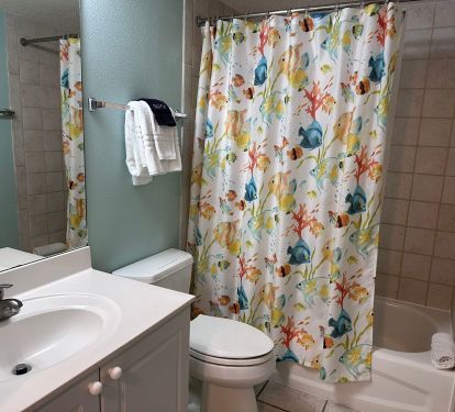 Bathroom for bedroom #2 with entrance from bedroom and hallway.