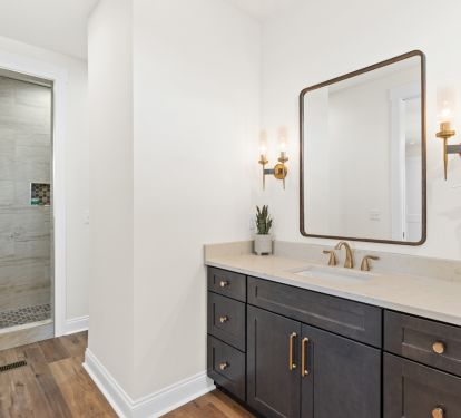 Rear Master En Suite Bathroom  with a Peek into the Large Tiled Shower
