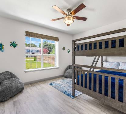 Kids full bunk room with comfy bean bags for game playing or tv watching.