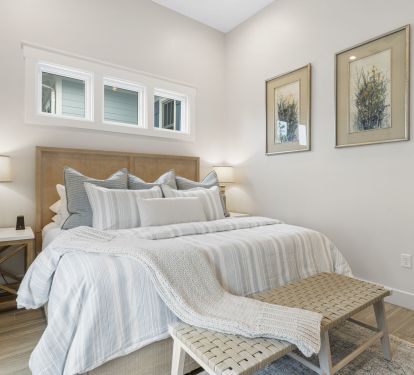 Luxury King Bed with Luxury Cotton Linens- Cell phone chargers on nightstand