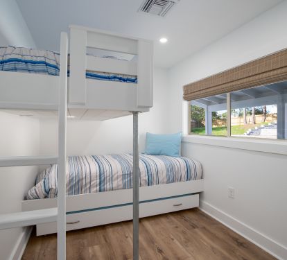 Great space for the kids in this bunk room featuring twin XL over twin XL with extra twin trundle.