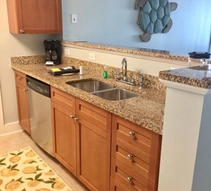 Kitchen has stainless steel appliances and granite countertops.