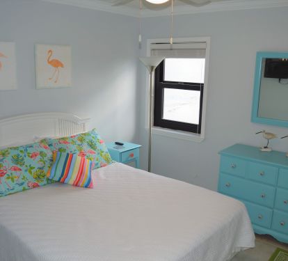 Queen bedroom with Smart TV, ceiling fan, large closet