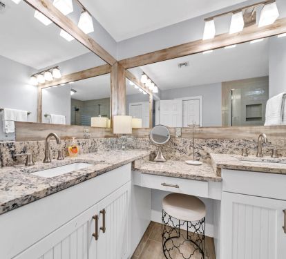 Recently renovated primary bath with double sinks and knee space