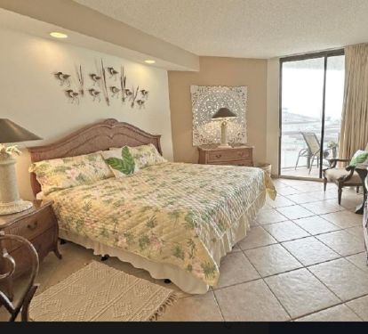 Master Bedroom includes smart TV, desk, balcony access and walkin closet.