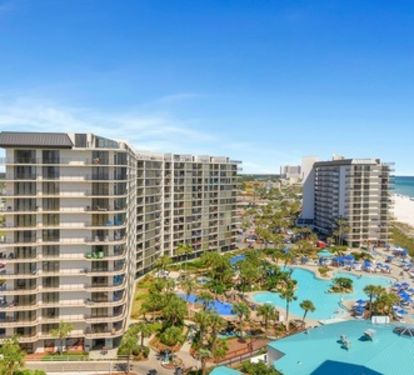 View of lagoon pool from walkway outside condo