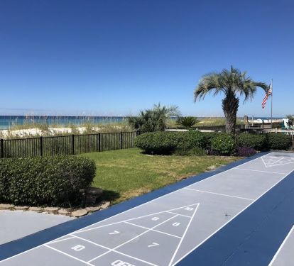 The view and sounds of the ocean enhance a fun match of shuffleboard.  This 15th century game appeals to competitors of all ages!