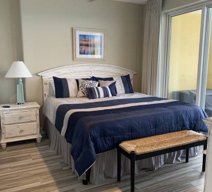 King size bed in the master bedroom with recently purchased mattress.