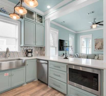 Seafoam-6 Quartz counters with open layout ensures that the family chef gets included in family time while whipping up the next culinary masterpiece.