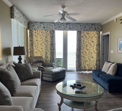 living rm -New neutral curtain (not shown)  on doors / windows - open up to balcony-on beach