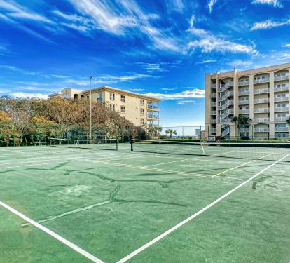 Enjoy a friendly match on our lighted tennis courts with a beachside breeze!