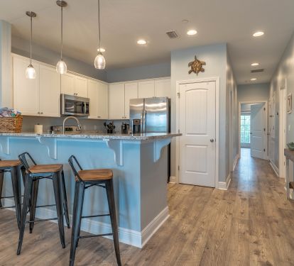 Full kitchen with seats for 4 at the bar and dining for 6. Highchair included