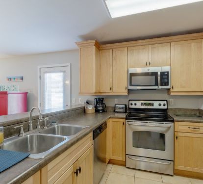 Kitchen has stainless steel appliances and all cooking items you would need!